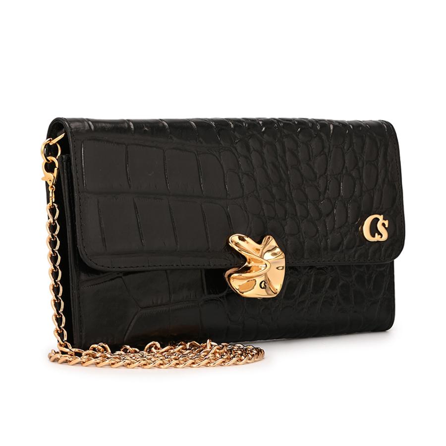 CLUTCH WITH ORGANIC EMBELLISHMENT