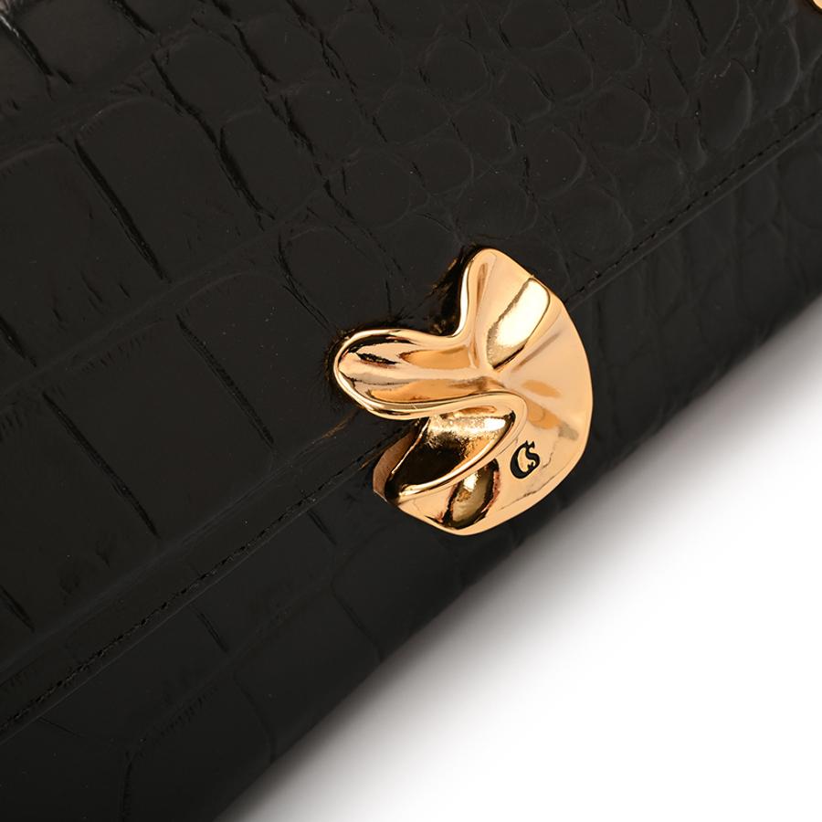 CLUTCH WITH ORGANIC EMBELLISHMENT