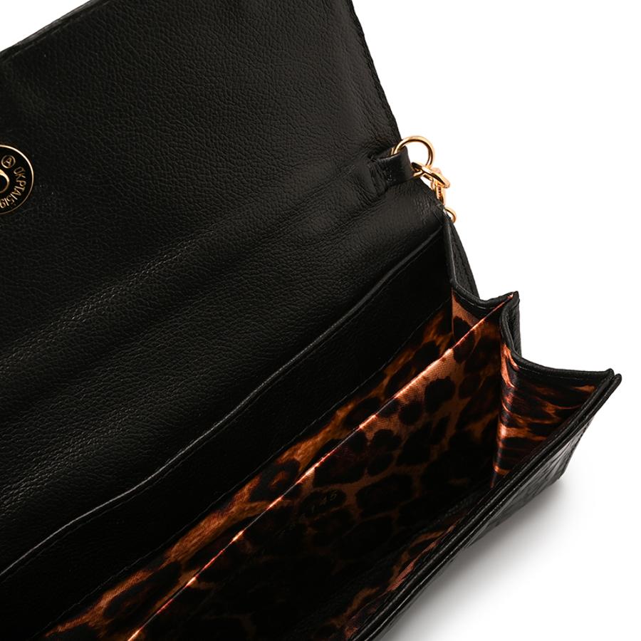 CLUTCH WITH ORGANIC EMBELLISHMENT